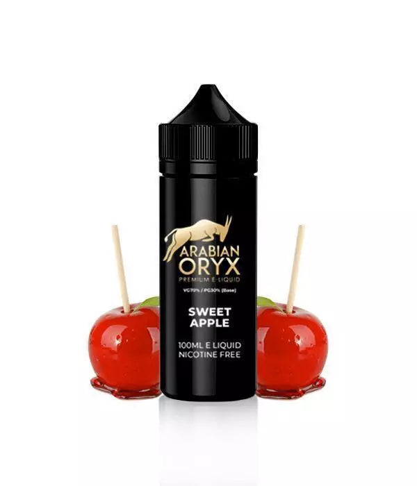 A 100ml bottle of Sweet Apple flavored ARABIAN ORYX E Liquid with a black cap, displayed alongside two apple candies on sticks. The label indicates the flavor and nicotine content of the juice.