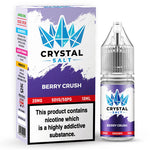 Load image into Gallery viewer, A bottle of Berry Crush Crystal Salt Nic Salt E Liquid next to its packaging box, which indicates the product contains nicotine.

