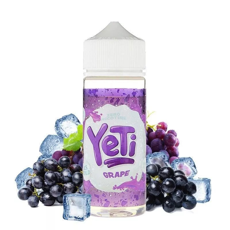 A 100ml bottle of YETI E-Liquid with grape flavor, surrounded by whole grapes and ice cubes, emphasizing the grape flavor profile of the e-liquid.